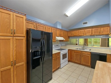 Experience the ease of low maintenance living in this bright and on Meadowbrook Golf Club in Florida - for sale on GolfHomes.com, golf home, golf lot