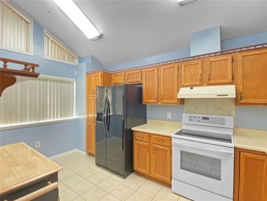 Experience the ease of low maintenance living in this bright and on Meadowbrook Golf Club in Florida - for sale on GolfHomes.com, golf home, golf lot