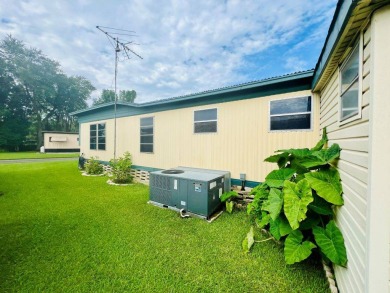 WELCOME TO THIS CHARMING HOME IN PRISTINE CONDITION!! This on Skyview Golf and Country Club in Florida - for sale on GolfHomes.com, golf home, golf lot