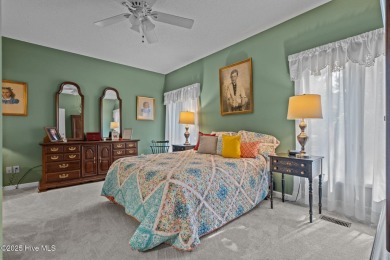 Welcome to 28 Windsong Place - A Serene Retreat in Whispering on Whispering Pines Golf Course in North Carolina - for sale on GolfHomes.com, golf home, golf lot
