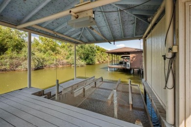 Stunning waterfront home in the coveted community of The Island on Harbor Lakes Golf Club in Texas - for sale on GolfHomes.com, golf home, golf lot