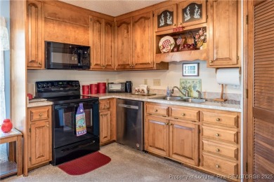 Welcome to this charming 3-bedroom, 2.5-bath home on Hole One of on Sandy Ridge Country Club in North Carolina - for sale on GolfHomes.com, golf home, golf lot