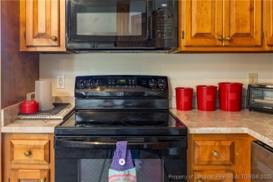 Welcome to this charming 3-bedroom, 2.5-bath home on Hole One of on Sandy Ridge Country Club in North Carolina - for sale on GolfHomes.com, golf home, golf lot