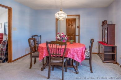 Welcome to this charming 3-bedroom, 2.5-bath home on Hole One of on Sandy Ridge Country Club in North Carolina - for sale on GolfHomes.com, golf home, golf lot