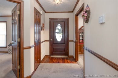 Welcome to this charming 3-bedroom, 2.5-bath home on Hole One of on Sandy Ridge Country Club in North Carolina - for sale on GolfHomes.com, golf home, golf lot