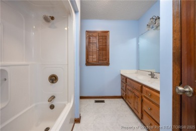 Welcome to this charming 3-bedroom, 2.5-bath home on Hole One of on Sandy Ridge Country Club in North Carolina - for sale on GolfHomes.com, golf home, golf lot