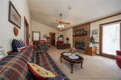 Welcome to this charming 3-bedroom, 2.5-bath home on Hole One of on Sandy Ridge Country Club in North Carolina - for sale on GolfHomes.com, golf home, golf lot