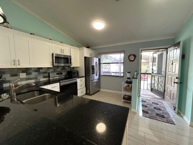 Beautifully renovated 2nd floor corner condo with expansive on Forest Oaks Golf Club in Florida - for sale on GolfHomes.com, golf home, golf lot