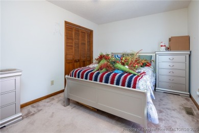Welcome to this charming 3-bedroom, 2.5-bath home on Hole One of on Sandy Ridge Country Club in North Carolina - for sale on GolfHomes.com, golf home, golf lot