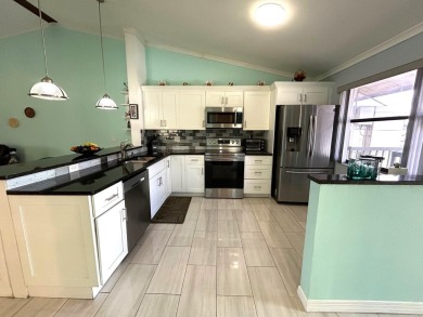 Beautifully renovated 2nd floor corner condo with expansive on Forest Oaks Golf Club in Florida - for sale on GolfHomes.com, golf home, golf lot