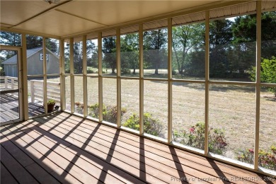 Welcome to this charming 3-bedroom, 2.5-bath home on Hole One of on Sandy Ridge Country Club in North Carolina - for sale on GolfHomes.com, golf home, golf lot