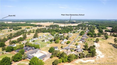 Welcome to this charming 3-bedroom, 2.5-bath home on Hole One of on Sandy Ridge Country Club in North Carolina - for sale on GolfHomes.com, golf home, golf lot