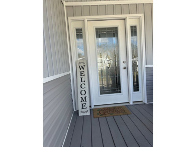 Entryway of the home has decorative frosted glass storm door on The Links of Lake Bernadette in Florida - for sale on GolfHomes.com, golf home, golf lot