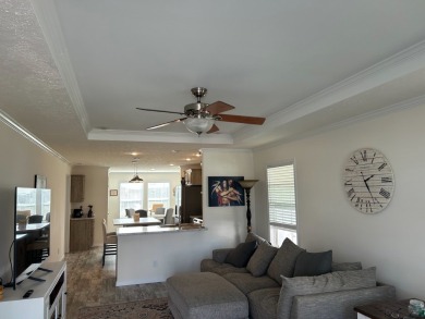 Entryway of the home has decorative frosted glass storm door on The Links of Lake Bernadette in Florida - for sale on GolfHomes.com, golf home, golf lot