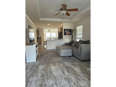 Entryway of the home has decorative frosted glass storm door on The Links of Lake Bernadette in Florida - for sale on GolfHomes.com, golf home, golf lot