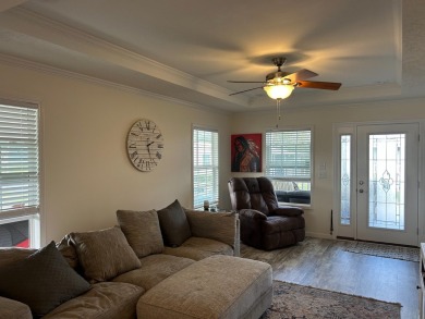 Entryway of the home has decorative frosted glass storm door on The Links of Lake Bernadette in Florida - for sale on GolfHomes.com, golf home, golf lot