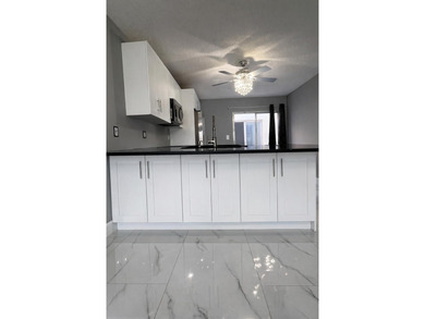 Welcome home! Fully renovated luxury patio home stands far above on Poinciana Golf Club in Florida - for sale on GolfHomes.com, golf home, golf lot