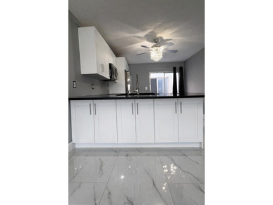 Welcome home! Fully renovated luxury patio home stands far above on Poinciana Golf Club in Florida - for sale on GolfHomes.com, golf home, golf lot