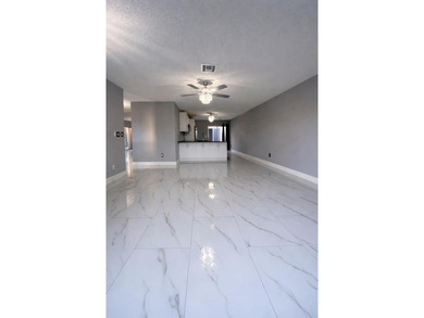 Welcome home! Fully renovated luxury patio home stands far above on Poinciana Golf Club in Florida - for sale on GolfHomes.com, golf home, golf lot