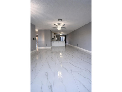 Welcome home! Fully renovated luxury patio home stands far above on Poinciana Golf Club in Florida - for sale on GolfHomes.com, golf home, golf lot