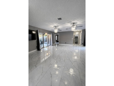 Welcome home! Fully renovated luxury patio home stands far above on Poinciana Golf Club in Florida - for sale on GolfHomes.com, golf home, golf lot