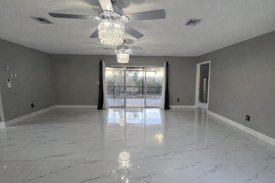 Welcome home! Fully renovated luxury patio home stands far above on Poinciana Golf Club in Florida - for sale on GolfHomes.com, golf home, golf lot