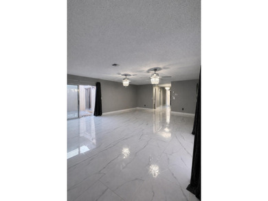 Welcome home! Fully renovated luxury patio home stands far above on Poinciana Golf Club in Florida - for sale on GolfHomes.com, golf home, golf lot