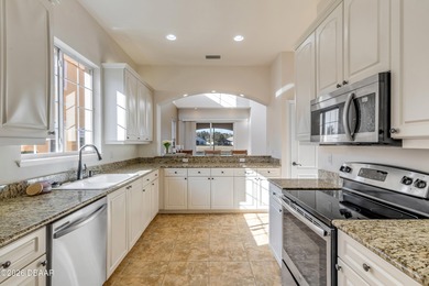 STOP SCROLLING - this is the END UNIT lakefront home you've been on Halifax Plantation Golf Club in Florida - for sale on GolfHomes.com, golf home, golf lot