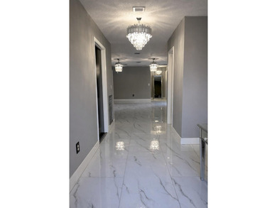 Welcome home! Fully renovated luxury patio home stands far above on Poinciana Golf Club in Florida - for sale on GolfHomes.com, golf home, golf lot