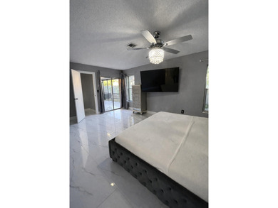 Welcome home! Fully renovated luxury patio home stands far above on Poinciana Golf Club in Florida - for sale on GolfHomes.com, golf home, golf lot
