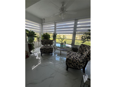 A beautifully remodeled two-bedroom, two-bathroom apartment on Sunrise Lakes Phase IV Golf Course in Florida - for sale on GolfHomes.com, golf home, golf lot