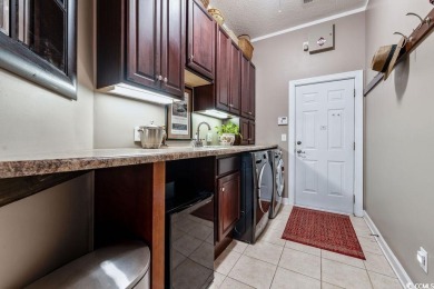 Discover this lovingly maintained 4-bedroom, 3-bath home in the on International Club of Myrtle Beach in South Carolina - for sale on GolfHomes.com, golf home, golf lot