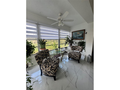 A beautifully remodeled two-bedroom, two-bathroom apartment on Sunrise Lakes Phase IV Golf Course in Florida - for sale on GolfHomes.com, golf home, golf lot