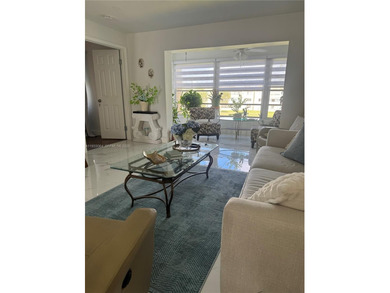 A beautifully remodeled two-bedroom, two-bathroom apartment on Sunrise Lakes Phase IV Golf Course in Florida - for sale on GolfHomes.com, golf home, golf lot