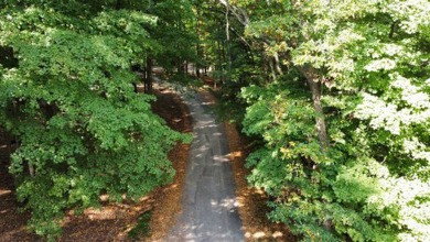 Double lot wooded property in Hocking Hills near the entrance in on Hide-A-Way Hills Golf Club in Ohio - for sale on GolfHomes.com, golf home, golf lot