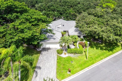 Photos feature remodel concept renderings.Set on a quiet on  in Florida - for sale on GolfHomes.com, golf home, golf lot