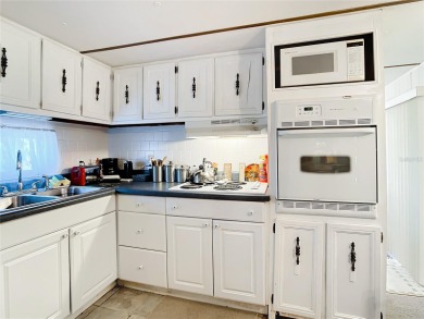 CHARMING, UNIQUE, MOBILE HOME IN FABULOUS HOLIDAY PARK, A on Sabal Trace Golf and Country Club in Florida - for sale on GolfHomes.com, golf home, golf lot
