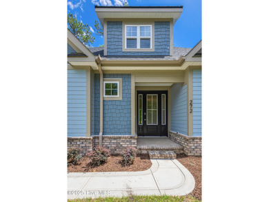 This brand new Riptide home with stunning setting and finishes on Sea Trail Golf Resort in North Carolina - for sale on GolfHomes.com, golf home, golf lot