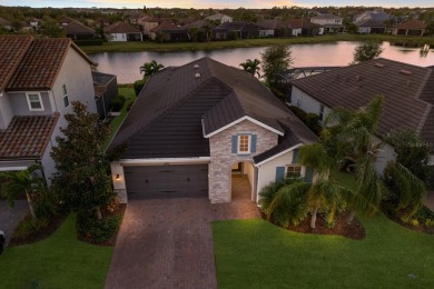 Under contract-accepting backup offers. CUSTOM WATERFRONT POOL on Esplanade Golf and Country at Lakewood Ranch in Florida - for sale on GolfHomes.com, golf home, golf lot