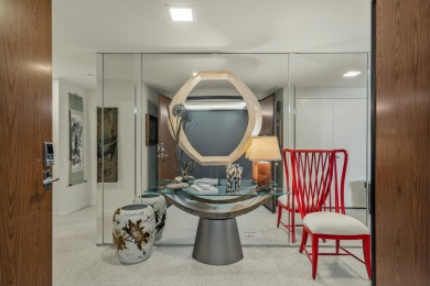 This 3-bed, 3-bath 3rd-floor condo at Desert Island combines on Desert Island Golf and Country Club in California - for sale on GolfHomes.com, golf home, golf lot