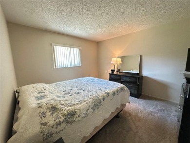Enjoy maintenance-free living in this well-maintained 2-bedroom on Beacon Woods Golf Club in Florida - for sale on GolfHomes.com, golf home, golf lot