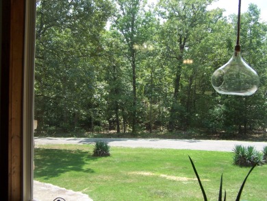 This charming 2 bedroom 1 1/2 bath is nestled among large shade on The Course At Turkey Mountain in Arkansas - for sale on GolfHomes.com, golf home, golf lot