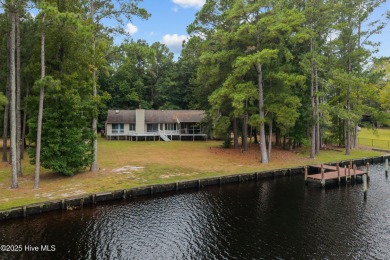 Welcome to your dream escape on the water! Nestled on wooded 2 on River Bend Golf and Country Club in North Carolina - for sale on GolfHomes.com, golf home, golf lot