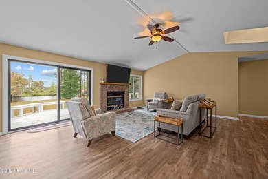 Welcome to your dream escape on the water! Nestled on wooded 2 on River Bend Golf and Country Club in North Carolina - for sale on GolfHomes.com, golf home, golf lot