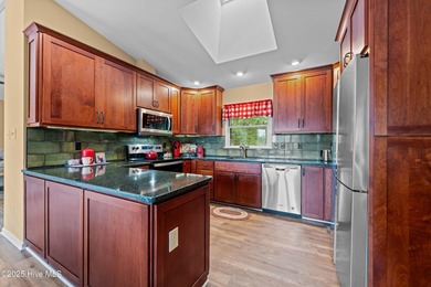 Welcome to your dream escape on the water! Nestled on wooded 2 on River Bend Golf and Country Club in North Carolina - for sale on GolfHomes.com, golf home, golf lot