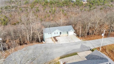 Well maintained 2 story home near beautiful Table Rock Lake sits on Holiday Island Executive Golf Course in Arkansas - for sale on GolfHomes.com, golf home, golf lot