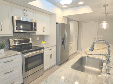 This spacious home has been remodeled and upgraded in the last 5 on Highland Lakes Executive Golf Course in Florida - for sale on GolfHomes.com, golf home, golf lot