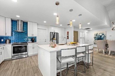This beautifully renovated home sits on a spacious corner lot on  in Florida - for sale on GolfHomes.com, golf home, golf lot