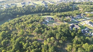 Gorgeous wooded bluff lot in the luxurious upscale gated on The Patriot in Oklahoma - for sale on GolfHomes.com, golf home, golf lot