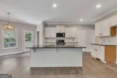 Spacious home nestled in the sought-after Bridgemill community on Bridgemill Golf Club in Georgia - for sale on GolfHomes.com, golf home, golf lot